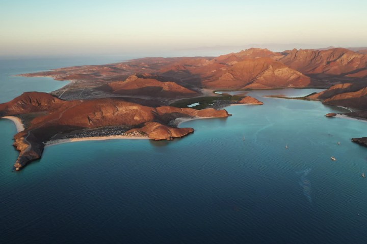a view of a body of water with a mountain in the background