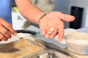 a person cooking food on a table