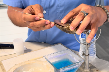 a man cutting food on a table